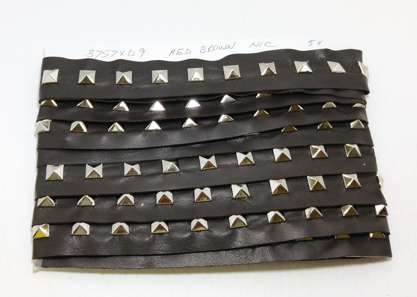 1 YD of 1-1/2" wide Genuine Cowhide Leather Trim Tape with Silver Square Pyramid Nailheads edge binding; top stitch; Med. Brown 3757XD9