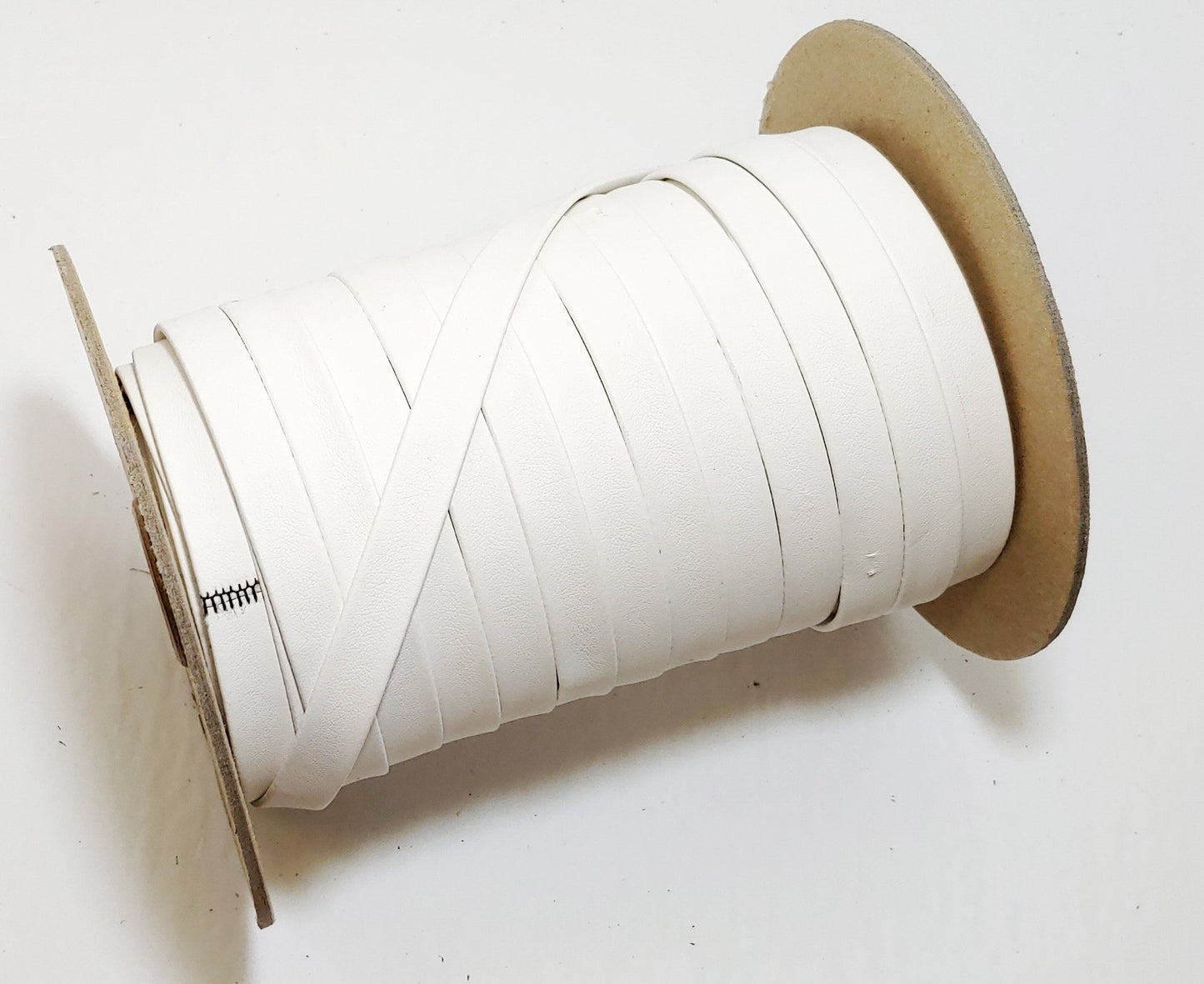 1/2" wide Eggshell White Polyurethane Faux Leather Strip (5 YDS) Vegan; Lamb Touch softness and finish; soft and supple; 0500BULT