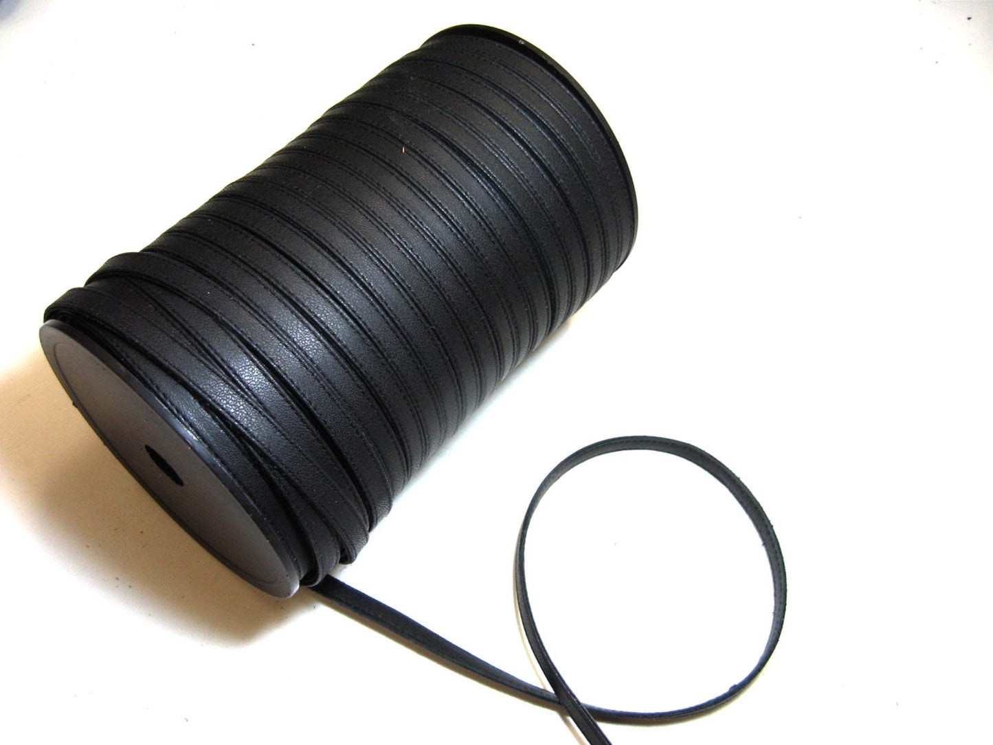3/8" Off-Center Fold reinforce Stitched to 3/8 Flat Cowhide Leather Stripping Black 1500 (2 yds) 3686XD8