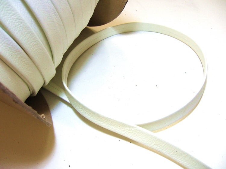 DISCOUNTED ITEM - 5/8" Double-Folded with Reinforcement, Damaged Cowhide Strap in Yellowed White (5 YDS) 0625RD