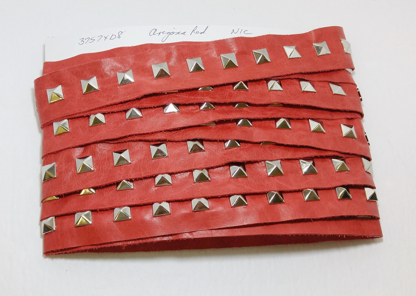 1 YD of 1-1/2" wide Genuine Cowhide Leather Trim Tape with Silver Square Pyramid Nailheads edge binding; top stitch; Arizona Red 3757XD8