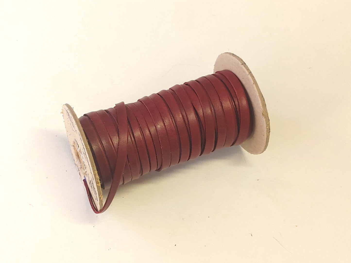 1/4" wide Cowhide Leather Lacing in Cherry UPL (5 yds) 0250DDE Side Folded w/o reinforcement